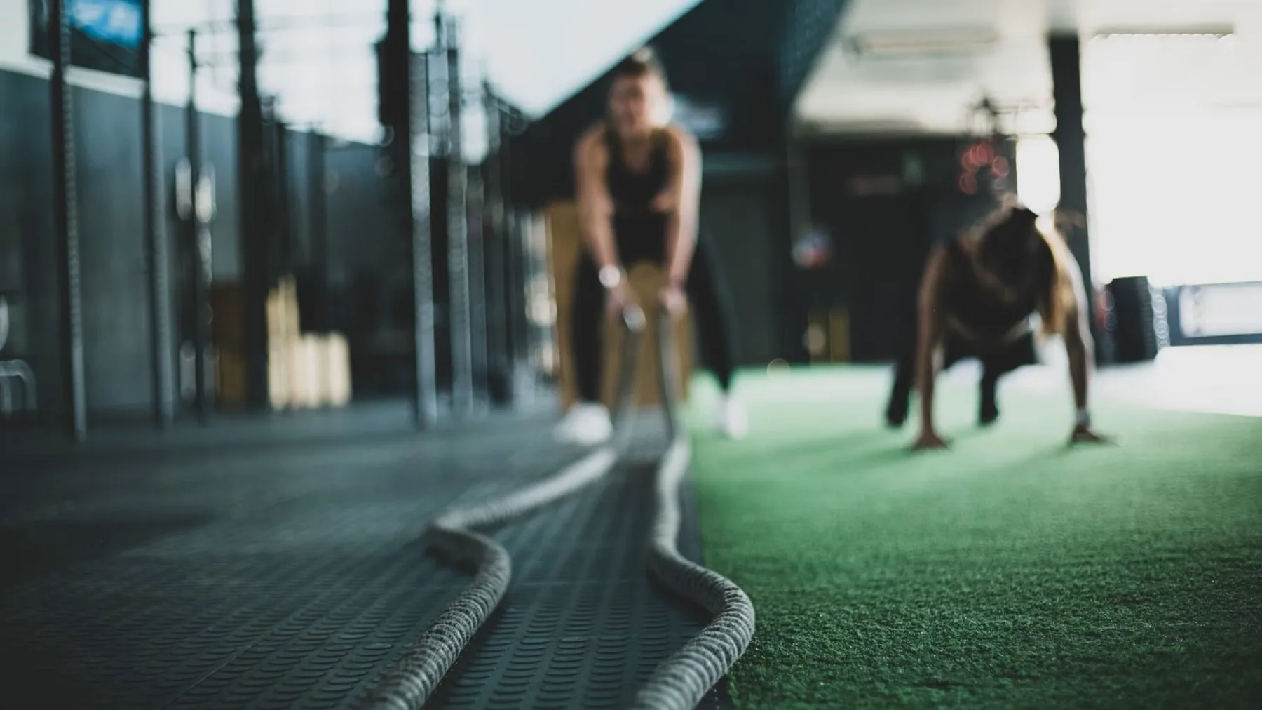 Training with battle ropes in a fitness studio